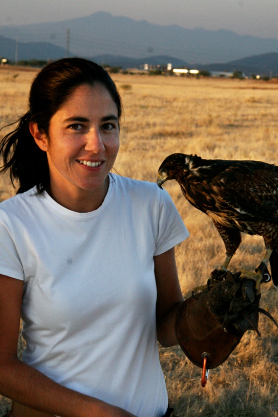 student holding a falcon